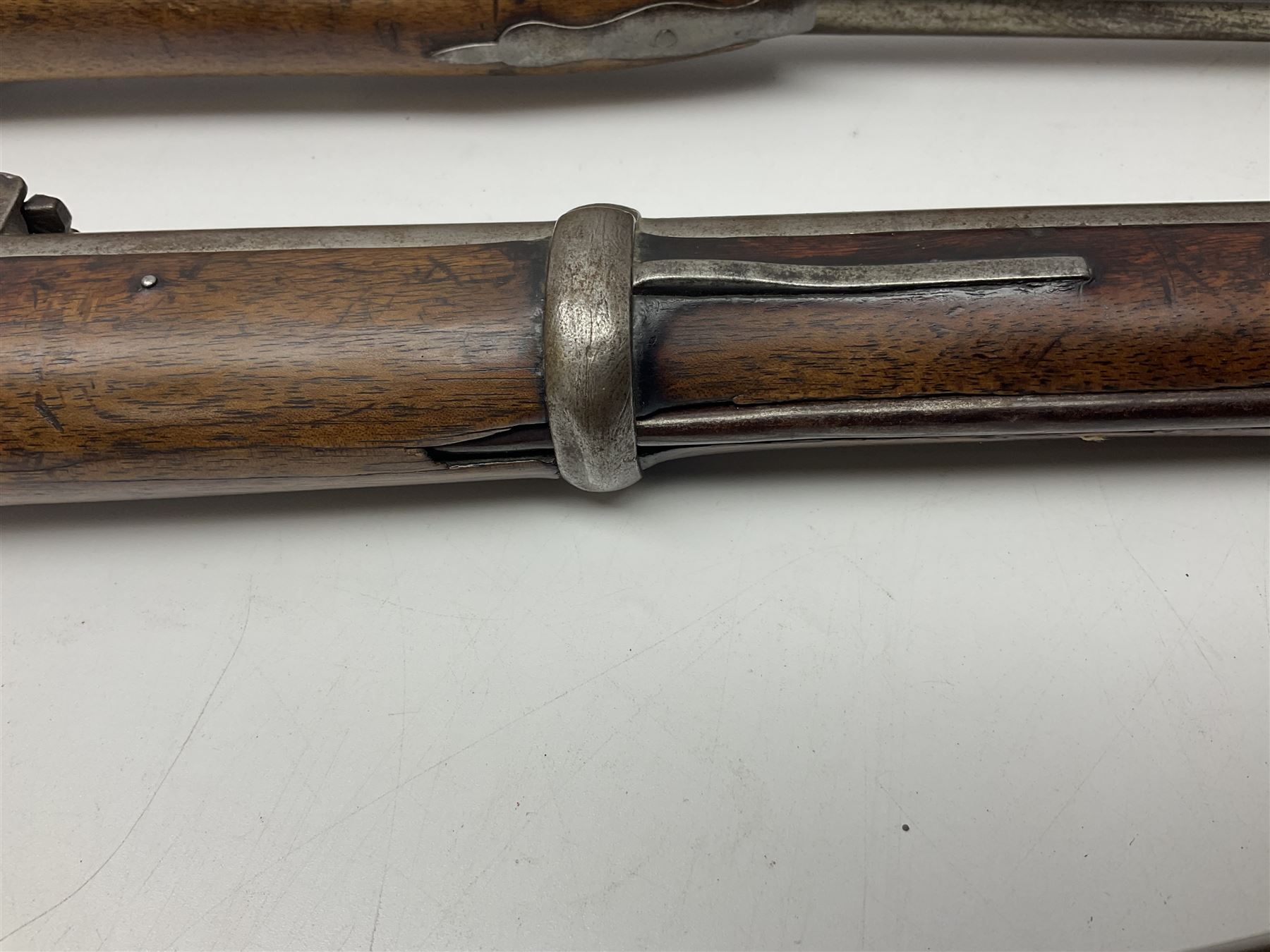 19th century Indian .577 Enfield muzzle loading rifle, proofed for 26-bore, the 98.5cm barrel with three barrel bands and later ram rod L140cm overall; 19th century Belgian side-by-side double barrel percussion shotgun, approximately 20-bore, with 74cm barrels and studded walnut stock, lock plate marked 'Liege 1868' and 'V. Gulikers-Maquinay' L117cm overall; and another side-by-side double barrel shotgun by Smythe with underlever opening (3)