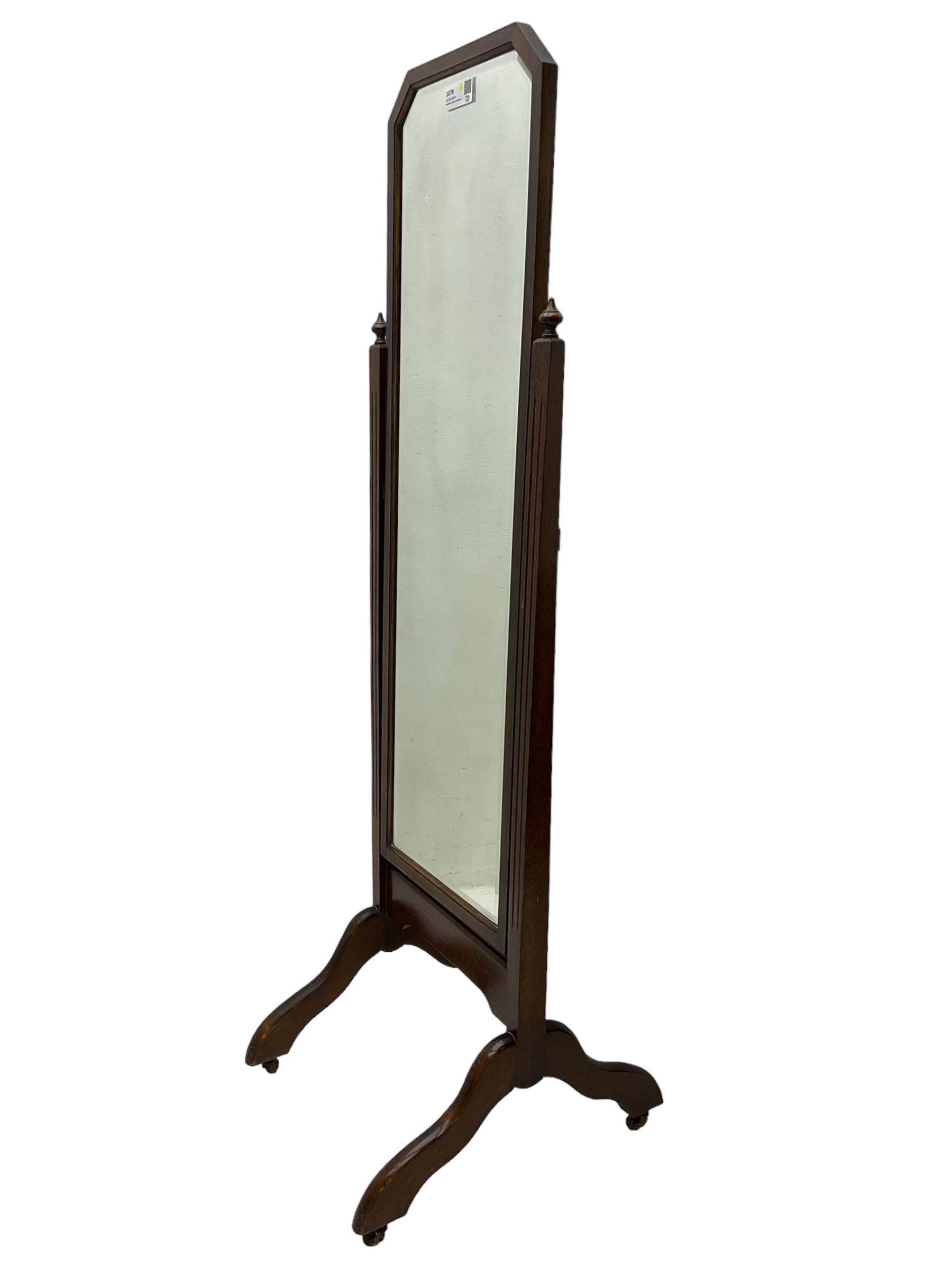20th century mahogany framed cheval dressing mirror, rectangular bevelled plate with canted top corners, fluted uprights on splayed end supports and castors