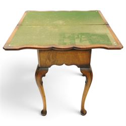Quality early 20th century Queen Anne design walnut card table, rectangular book-matched veneer fold-over and swivel top with scalloped edge enclosing baize-lined interior, fitted with shaped frieze drawer with brass pear-drop handles over shaped apron, raised on C-scroll carved cabriole supports with pad feet