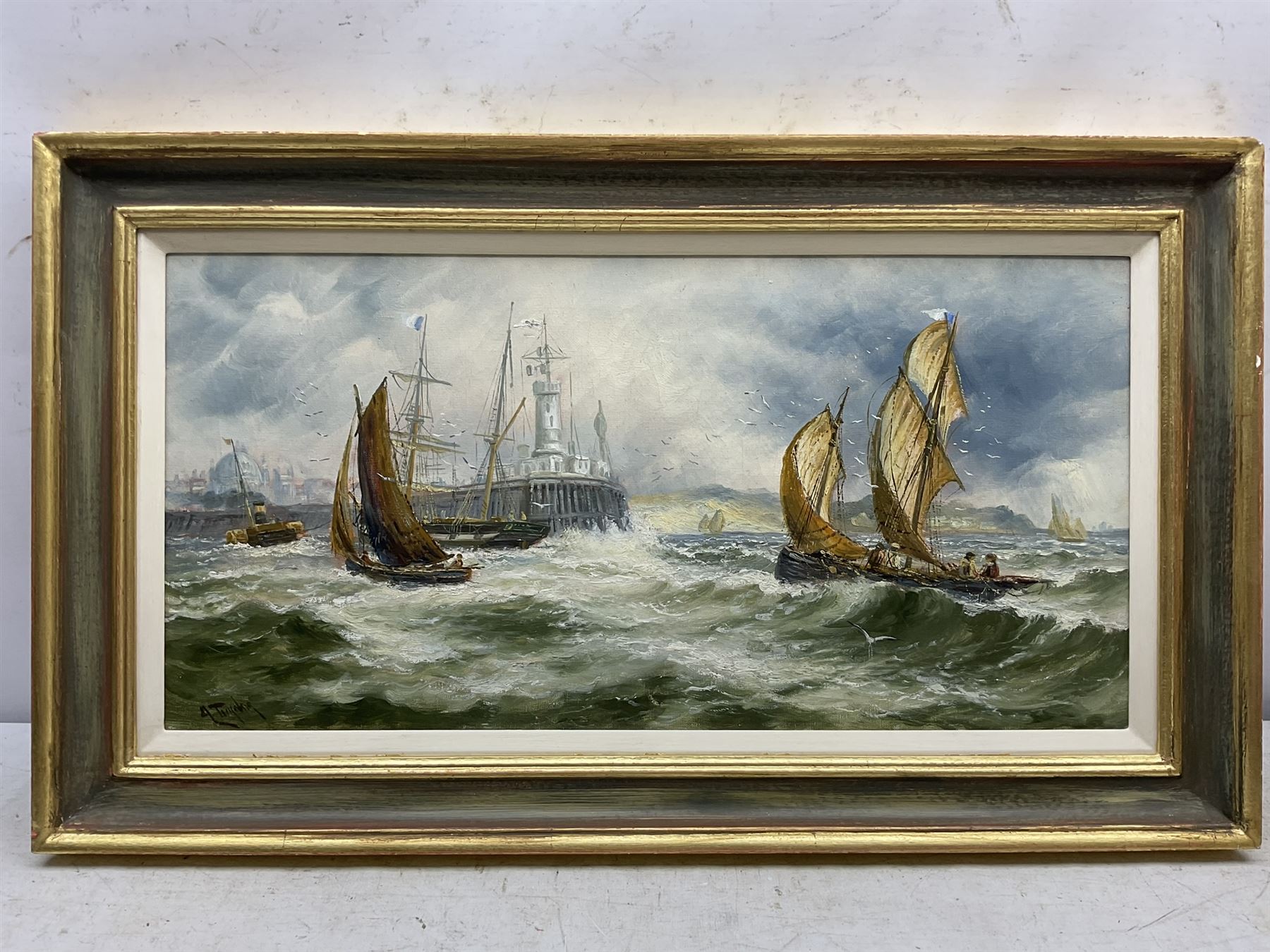 A Turner (British 19th century): Yarmouth Boats Rounding the Lighthouse, oil on canvas signed 30cm x 60cm