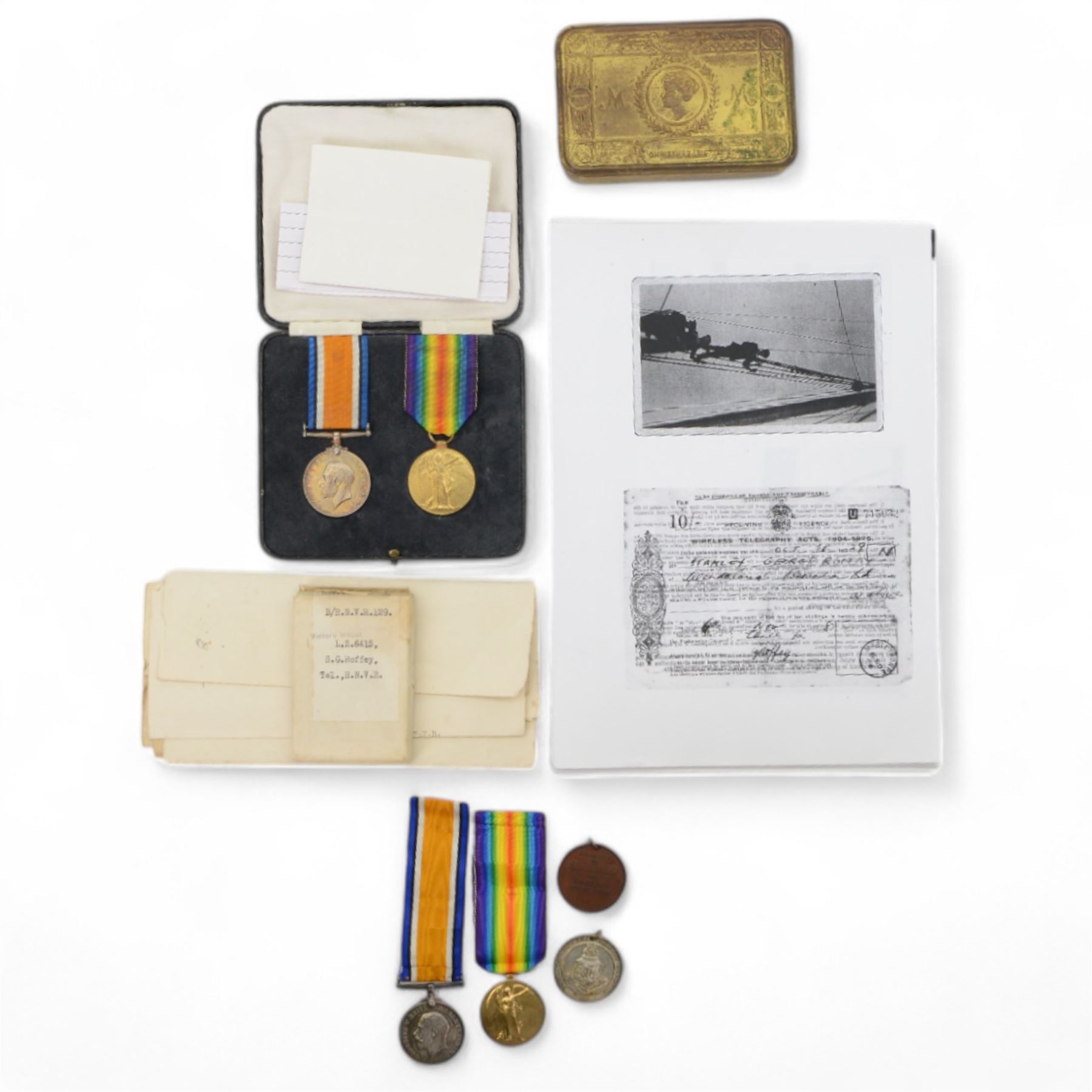 WWI two pairs of medals, British War Medal and Victory Medal,  awarded to 119982 Cpl Jesse Francis Stevens Royal Army Medical Corps and L.Z 6415 S.G Roffey Tel. Royal Naval Volunteer.Reserve, together with with two other WWII medals, 1914 Christmas tin and ephemera 
