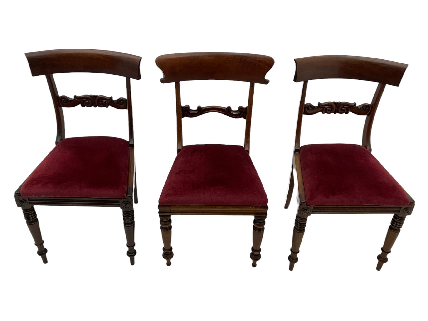 Seven early 19th century mahogany dining chairs - set six side chairs with scroll carved middle rails (W46cm), and a carver elbow chair with rope twist middle rail