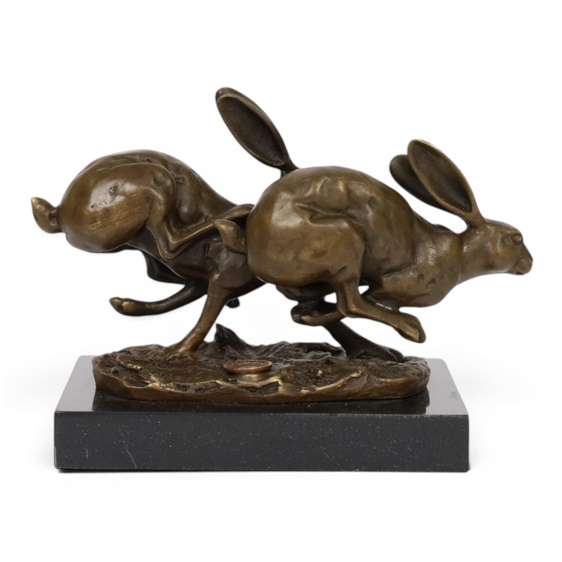Bronze figure group, modelled two hares in chase, upon naturalistically modelled oval base signed Nick and with foundry mark, raised upon black marble base, H11cm L12.5cm