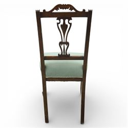 Late Victorian mahogany side chair, the carved cresting rail above a pierced and carved splat with lyre-form detail, the back panel inset with cane work, drop-in upholstered seat in pale green fabric with braid trim, raised on cabriole supports