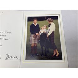 The Prince and Princess of Wales (Charles and Diana) - signed Christmas card, inscribed to Mr. Fryer, signed in ink by Charles and Diana; mounted colour photograph depicting Charles and Diana with young Princes William and Harry; gilt crests to upper board; complete with original envelope, postmarked Buckingham Palace, 17 December 1985