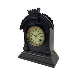 An American Ansonia 8-day striking mantle clock c1880 in a carved ebonised wooden case, with a cream enamel dial, Roman numerals and minute track, steel fleur di Lis hands within a glazed bezel with egg and dart decoration, open spring movement striking the hours and half hours on a coiled gong, with pendulum regulation, movement stamped Ansonia Clock Company, New York.
With pendulum.
