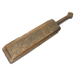 19th century oak mangle board, incised date 1864, decorated with a flower emerging from a ...