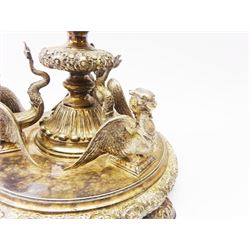 A large Victorian Thomas Bradbury & Sons silver plated candelabrum, the circular base with flower head border upon three domed feet, supporting a central knopped and fluted column flanked by three zoomorphic creatures, leading to a central socket with removable nozzle above a large palmette detailed drip pan, and three scrolling branches with conforming sockets and nozzles, with maker's silver plate mark and Victorian registration lozenge beneath, H62.5cm
