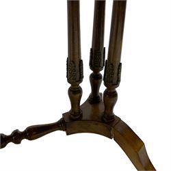 Early 20th century walnut coffee table, oval dished top with sunburst matched veneer, raised on twin cluster columns united by turned stretcher base on splayed supports