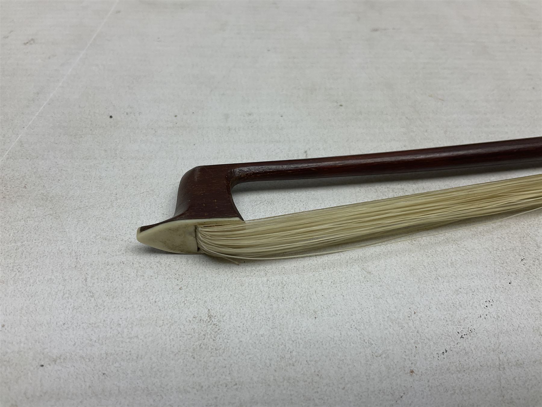 German copy of a Maggini violin c1900 with 35.5cm two-piece maple back and ribs and spruce top, bears label 'Maggini Deutsche Arbeit 1866' L59cm; in carrying case with bow