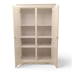 Modern white painted double wardrobe, fitted with two panelled doors, enclosing a hanging rail and shelving, raised on bracket feet