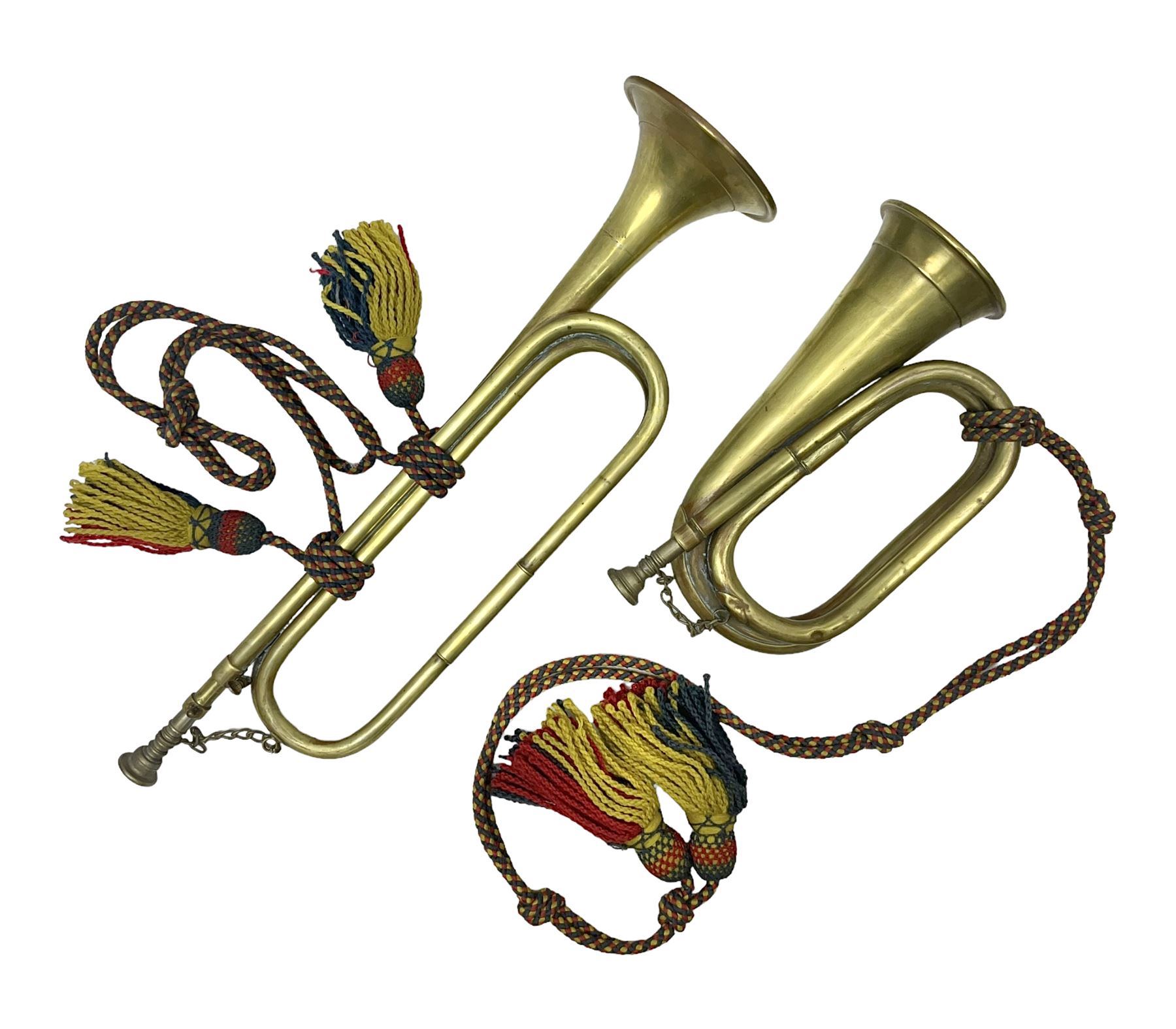Two military brass bugles by Mayers and Harrison Ltd. Manchester each with crows foot mark and dated 1966; both with multi-coloured cord and tassels, longest 52.5cm (2)