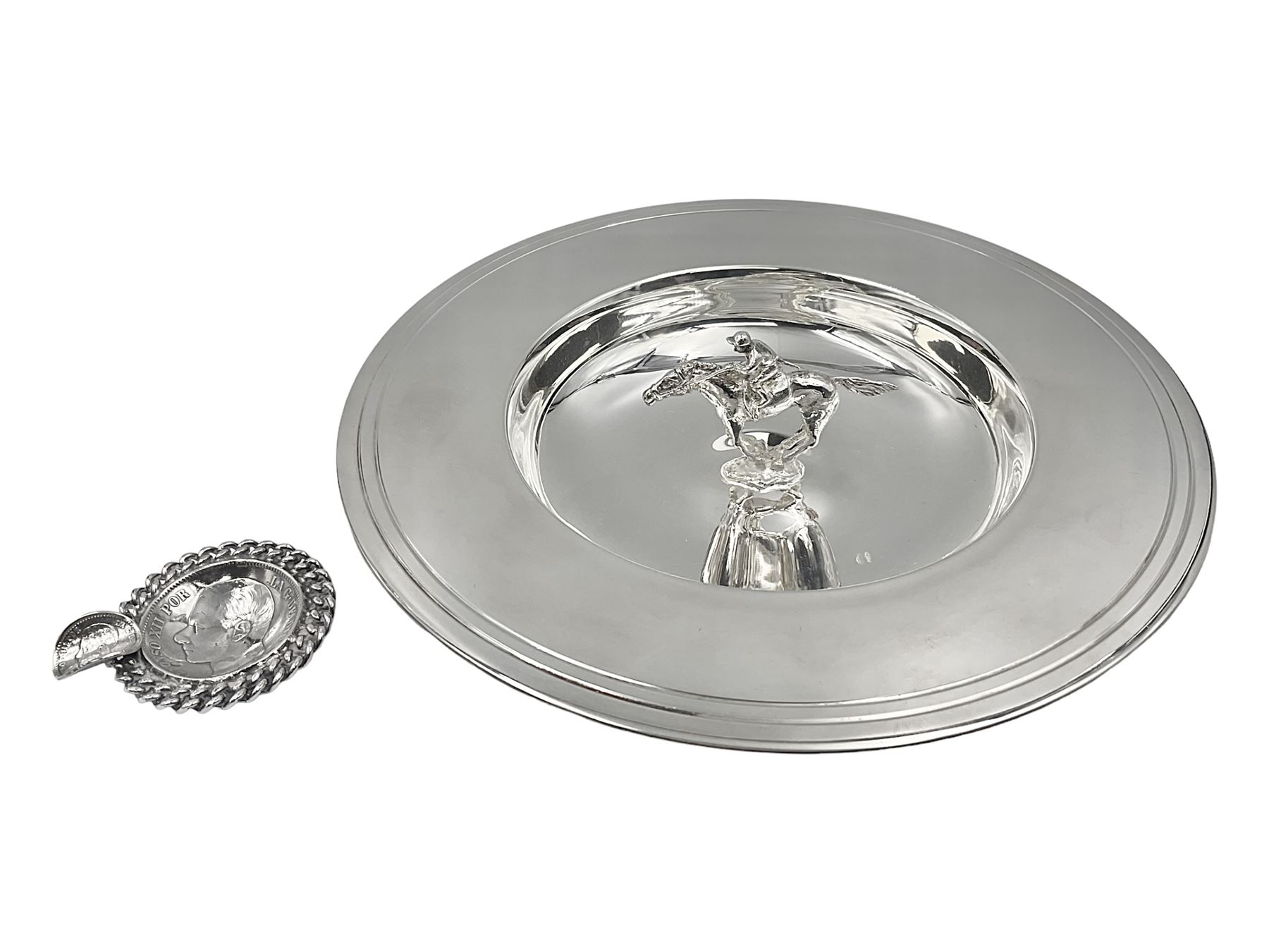 Spanish silver coin dish, with white metal chain rim and upon three ball feet, together with a silver plated armada style dish, with cast racehorse and jockey to centre, coin dish D4.8cm, armada dish D20.5cm