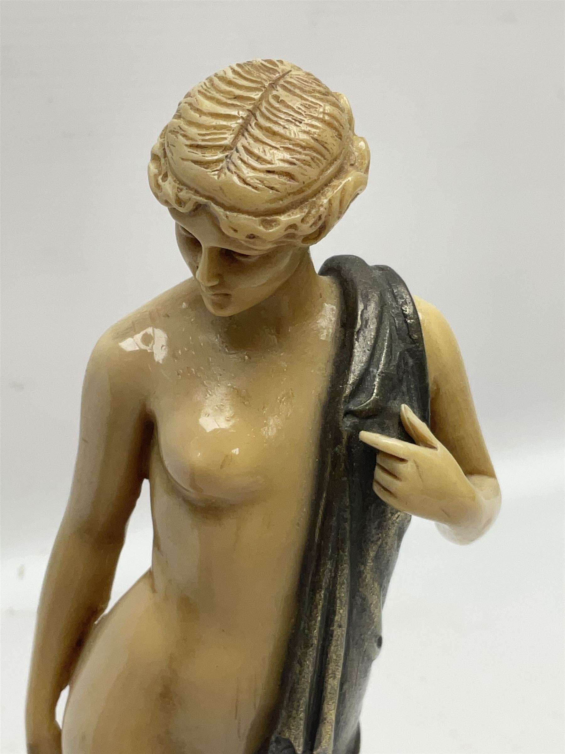 After Ferdinand Preiss (1882-1943), pair of Art Deco style, composite semi nude classical female figures, raised on circular onyx bases, H21cm
