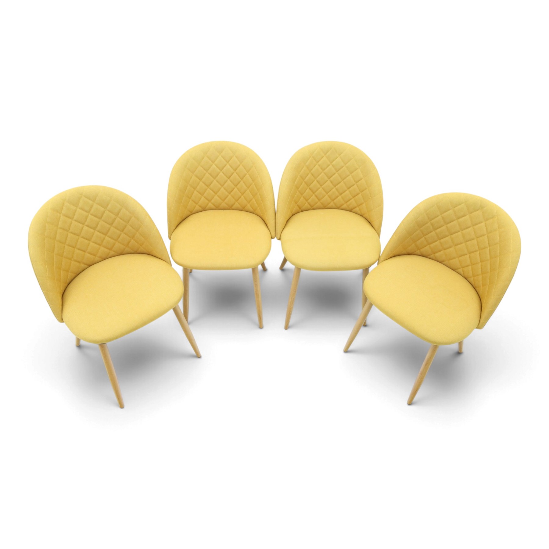 Set of four contemporary yellow upholstered dining chairs, with wrap around back with quilted stitching, padded seat raised on light oak tapering supports 