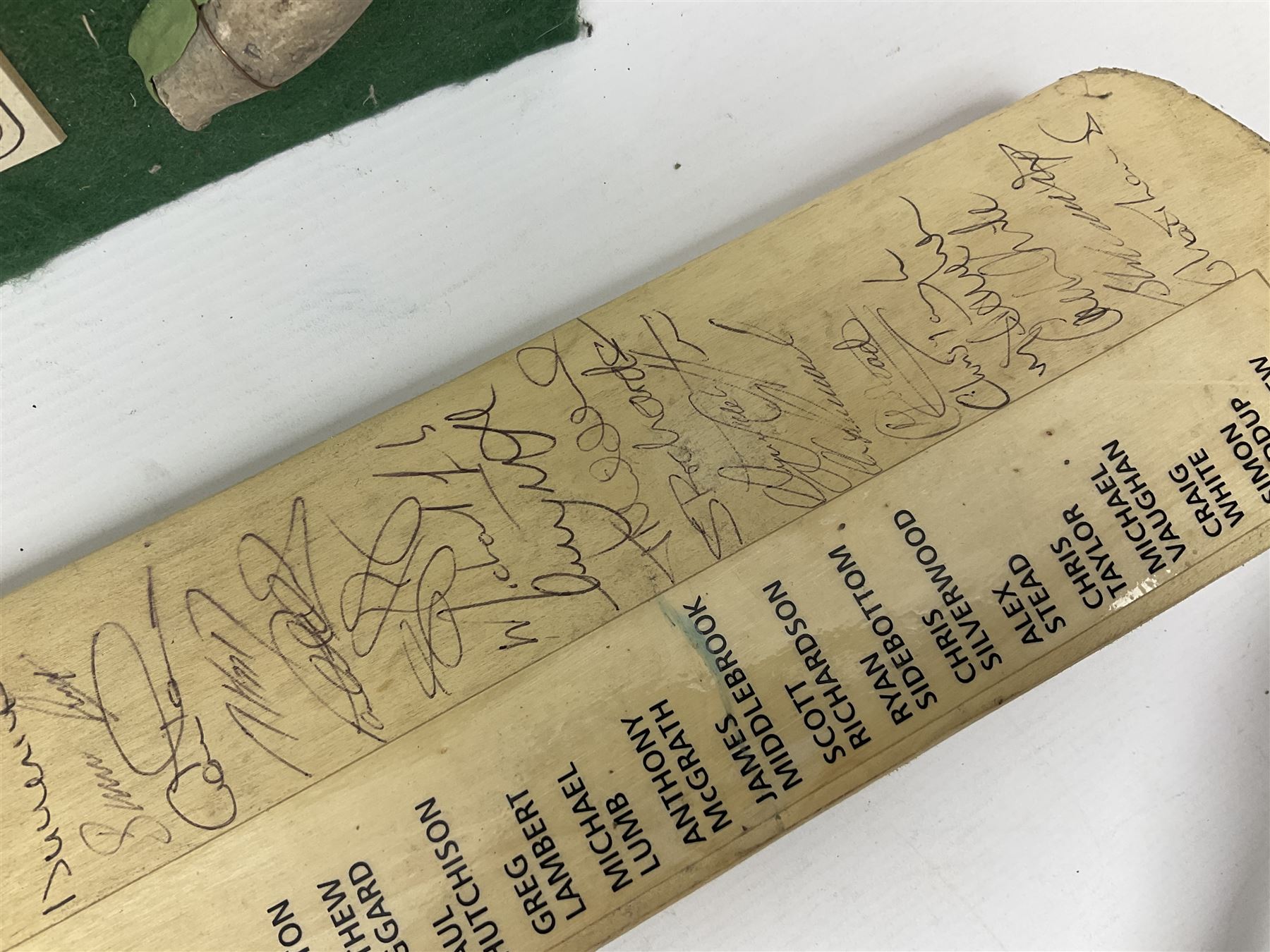 Annotated display board of clay pipes; rootwood walking stick and Yorkshire CCC signed cricket bat 2001