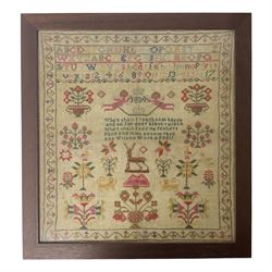 William IV sampler worked by Ann Wilson, depicting bands of alphabet and numbers above date of 1834, and verse detailed 'When shall I reach that happy And be for ever blest place When shall I see my fathers Face and in his bosom rest Ann Wilson Work Aged 11', amidst various motifs including putti, stag, and flowering urns, within a foliate border, framed and glazed, overall H44cm W41cm