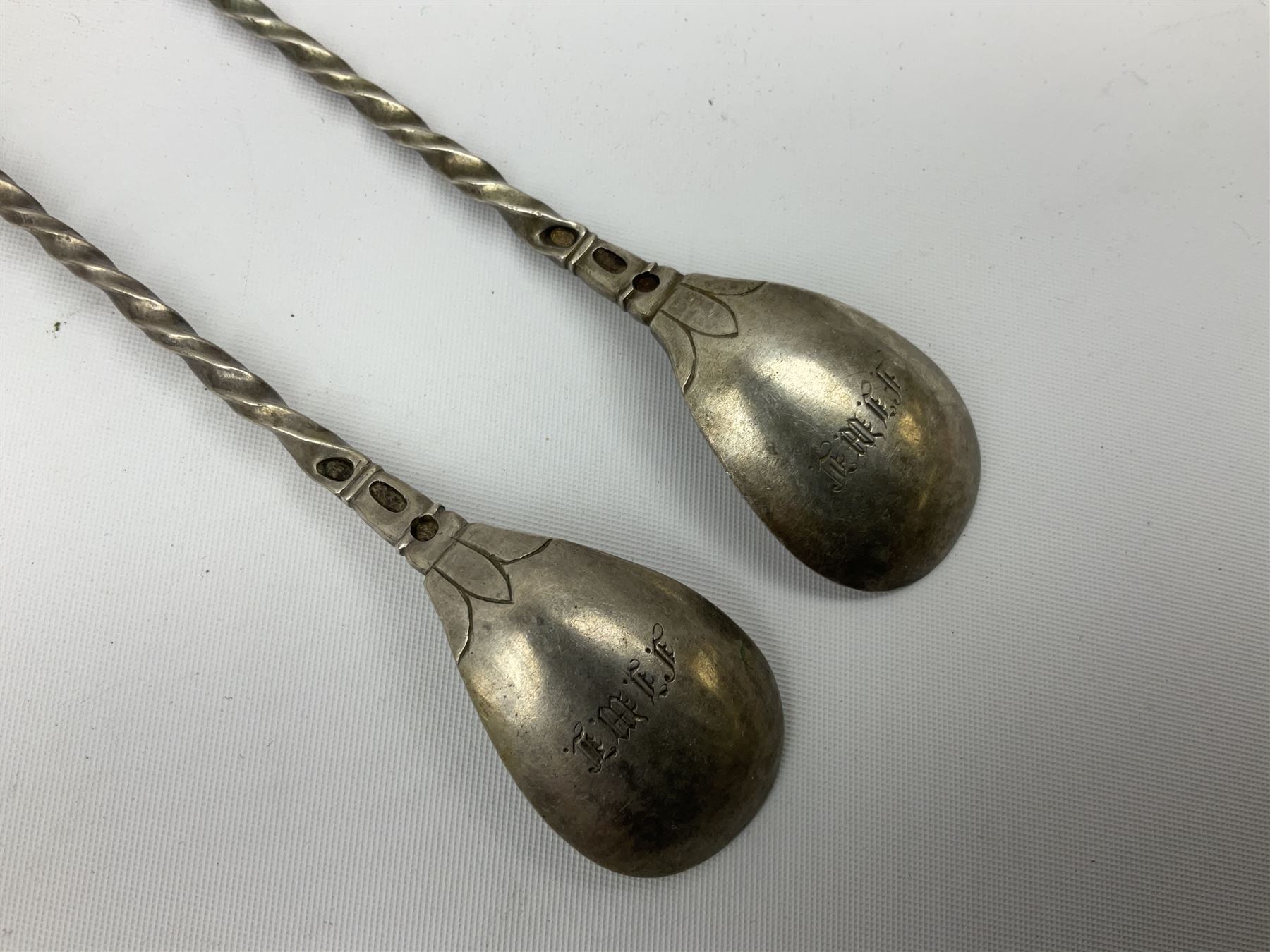 Small silver dish with repousse scrolling edge, stamped Sterling, together with a pair of Danish silver spoons, approximate total weight 61.4 grams