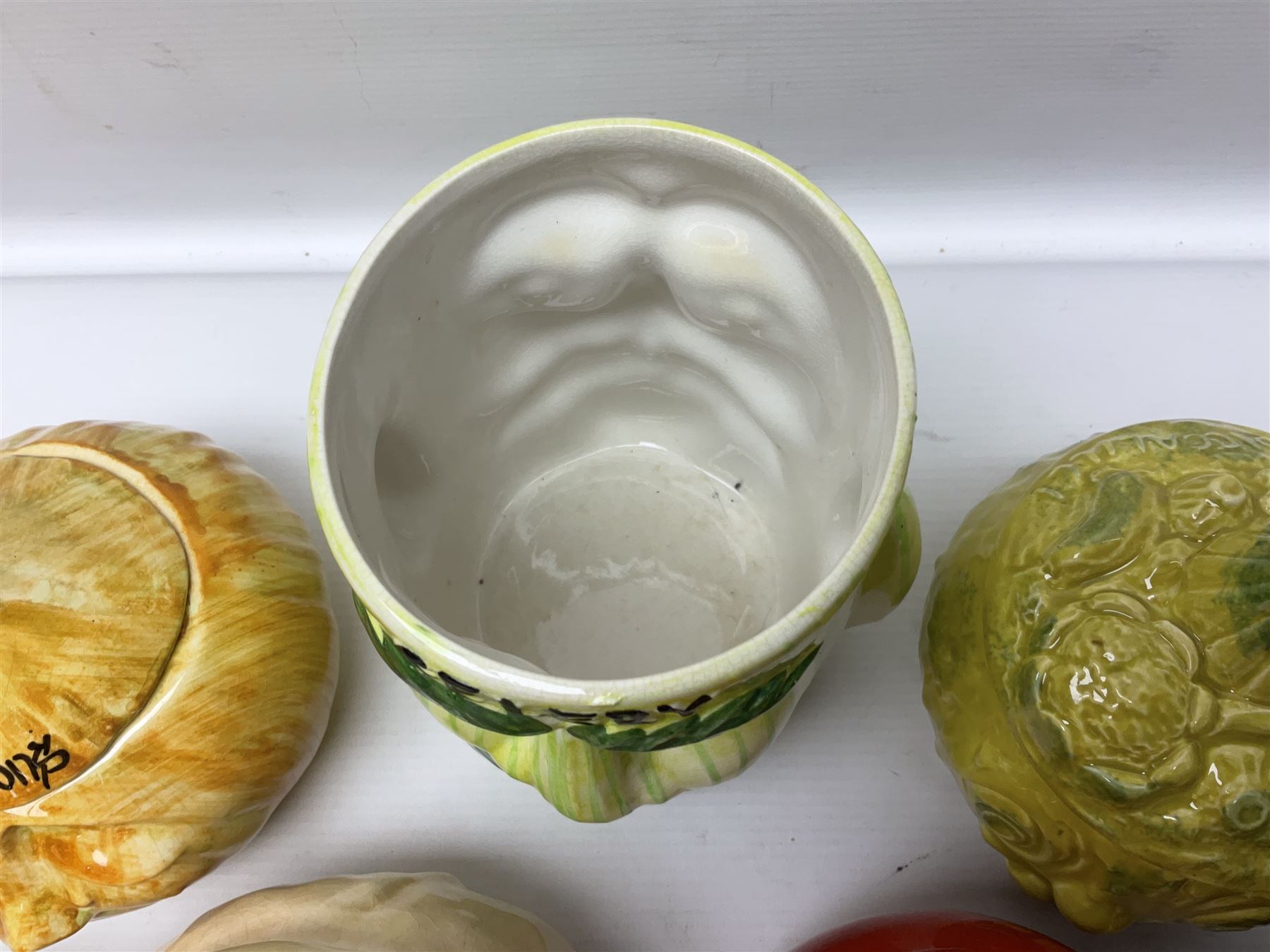 Collection of mostly Sylvac kitchen storage jar face pots, including piccalilli, chutney, tomato and bread sauce, tallest H15.5cm