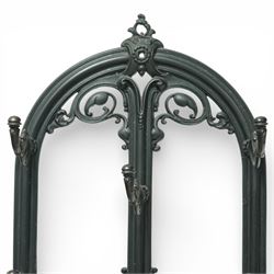 Late 19th century cast iron stick stand, the arched back with scrolling foliate decoration, fitted with multiple hooks, the lower section with pierced panels centred by a radiating sunburst motif, raised on a rectangular drip tray base