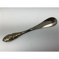 Set of six silver handled butter knives, and a silver handled shoehorn, all hallmarked, but hallmarks worn and indistinct
