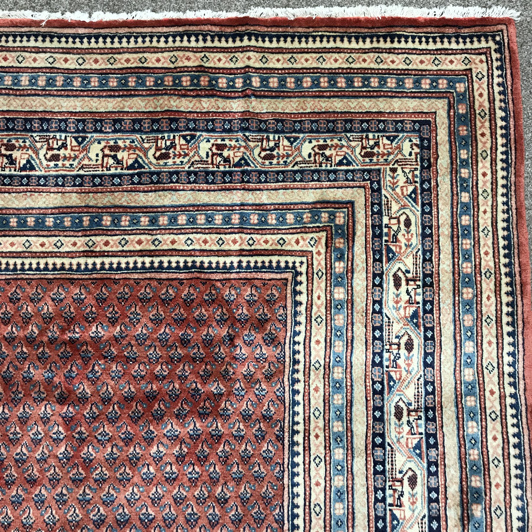 Large Persian Araak red ground rug, multiple band border, repeating