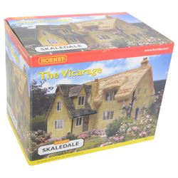 Eleven Hornby '00' gauge Skaledale buildings, comprising R9771 Three Barrels Wine Bar, R8534 Signal Box, R8747 Electricity Sub Station, R8585 Lamp Hut, R8586 Platelayers Hut, R8575 War Memorial, R9828 Bakers Shop, R9767 Andrew James Butchers, R8504 Holly Farm Cottages, R8566 The Boar's Head and R8513 The Vicarige, all boxed