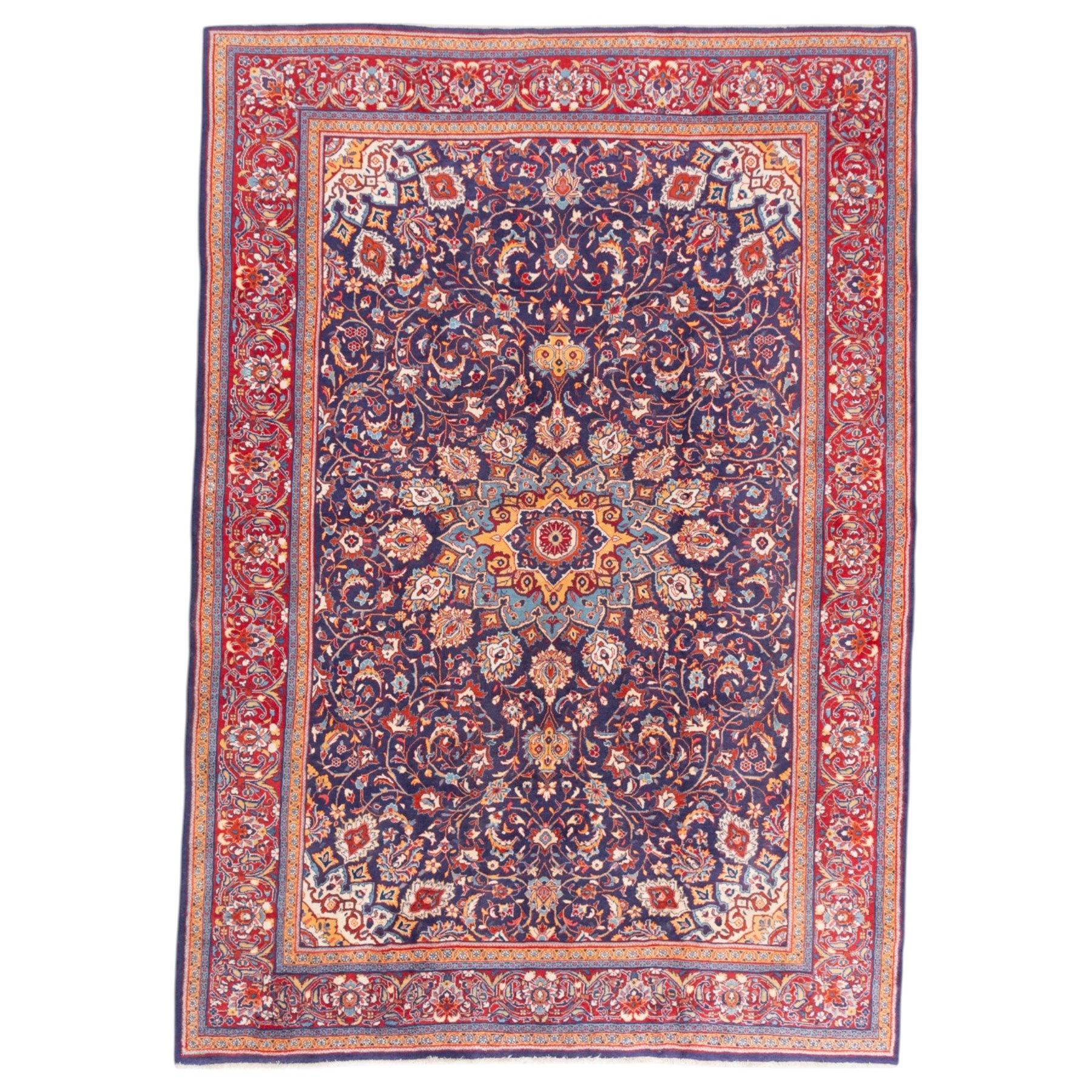North West Persian carpet, the indigo field centred by a lobed medallion in pale blue and ochre with floral pendants, profusely decorated with scrolling foliage, palmettes and flowerheads, ivory floral spandrels, enclosed by a red ground palmette border and multiple floral guard bands