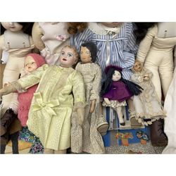 Collection of Victorian and later dolls, mostly soft bodied with ceramic heads, together with a dolls house miniature welsh dresser and doll collectors magazines and an applique village scene wall hanging