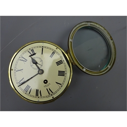  Smiths Astral ship's brass cased bulkhead clock, the white dial with Roman numerals, subsidiary seconds dial and slow/fast facility No 6123 D18cm with key  