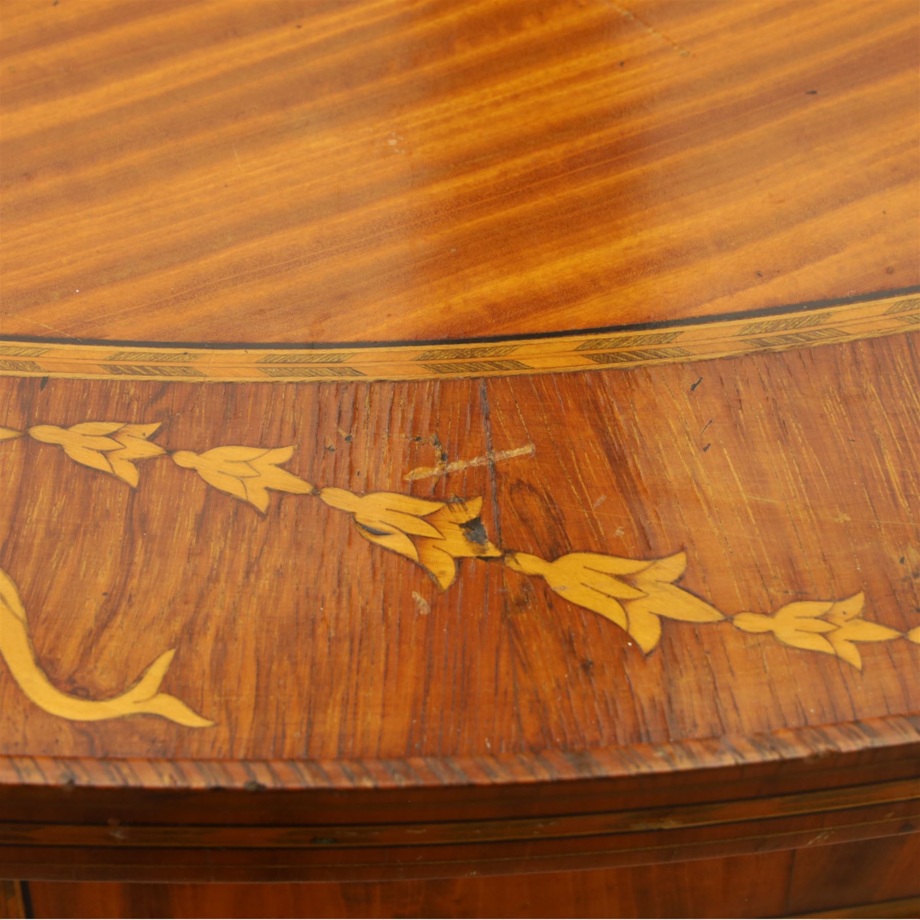 Aldam Heaton & Co (fl.1878-97) - late 19th century Sheraton revival style satinwood inlaid oval centre table, raised inlaid edge, centre with finely executed large central  inlaid medallion, surrounded by ribbon tied swags interspaced with medallions, frieze with rectangular symmetrical panels of foliate sprays of acanthus leaves, raised on four square section tapering legs with cavetti shaped shoulders with stringing on brass bulb feet, underside with bone plaque signed Aldam Heaton & Co, Baker St, London