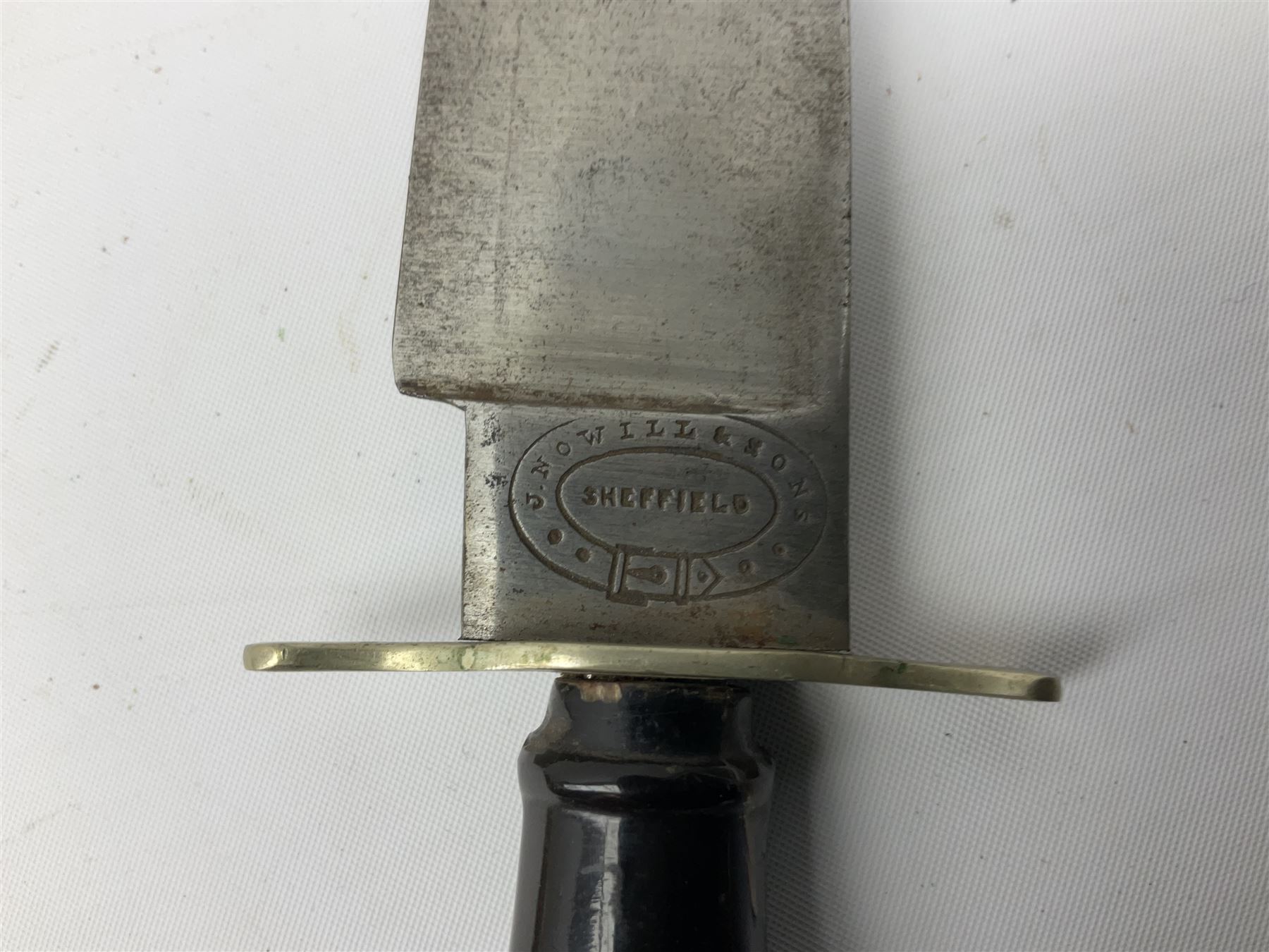 Hunting knife by J Nowill & Sons, Sheffield, the handle inset with mother of pearl, blade length 19cm; George Wolstenholme IXL lock-knife with antler scales L29cm open; and another Bowie style hunting knife marked 'V.R. Warranted Sheffield Joseph Ellis & Sons' in leather sheath (3)