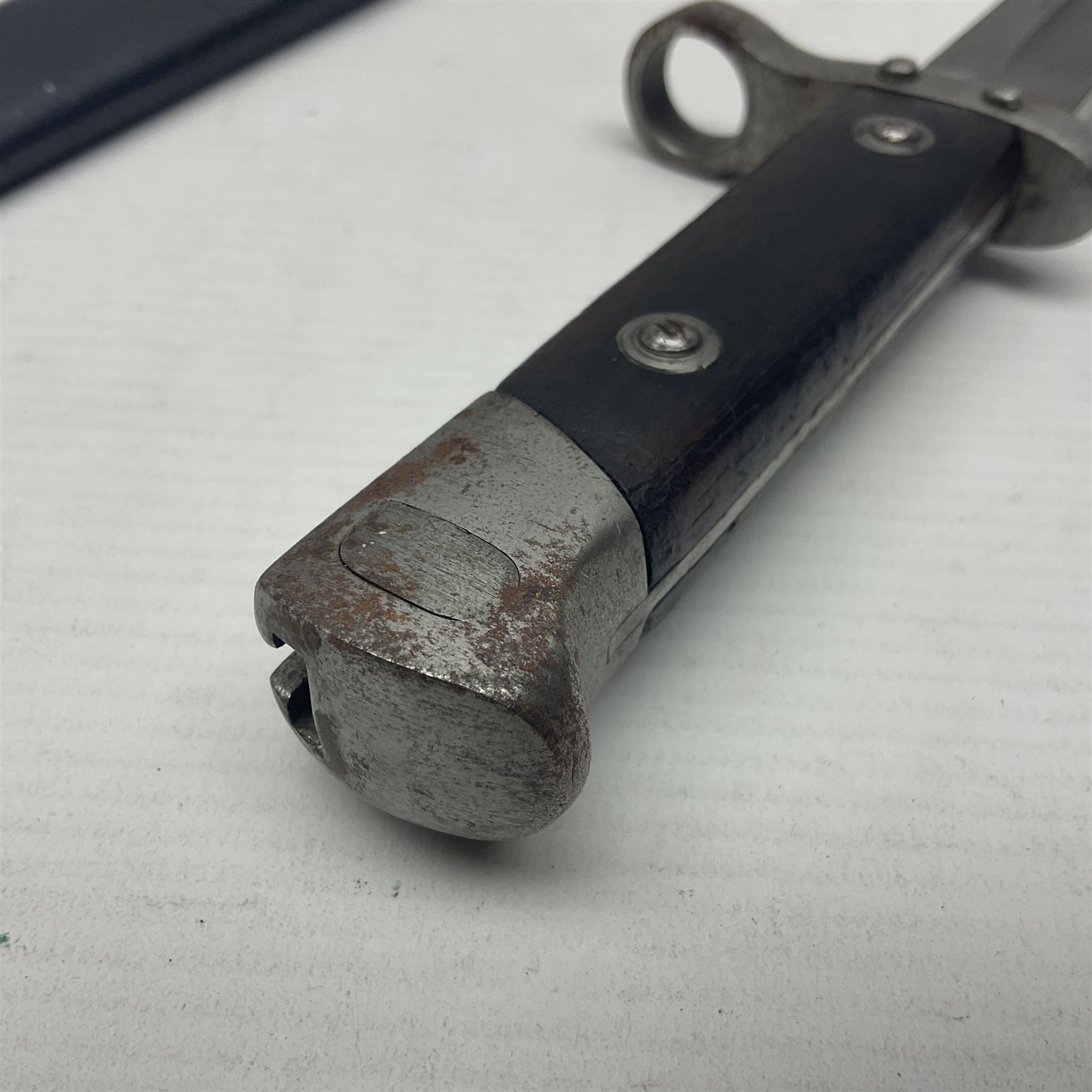 Austrian Model 1895 Carbine knife bayonet with 24.5cm fullered steel blade; various marks to the ricasso including F.G. GY.; cross-piece marked No.7843; in steel scabbard L37cm overall