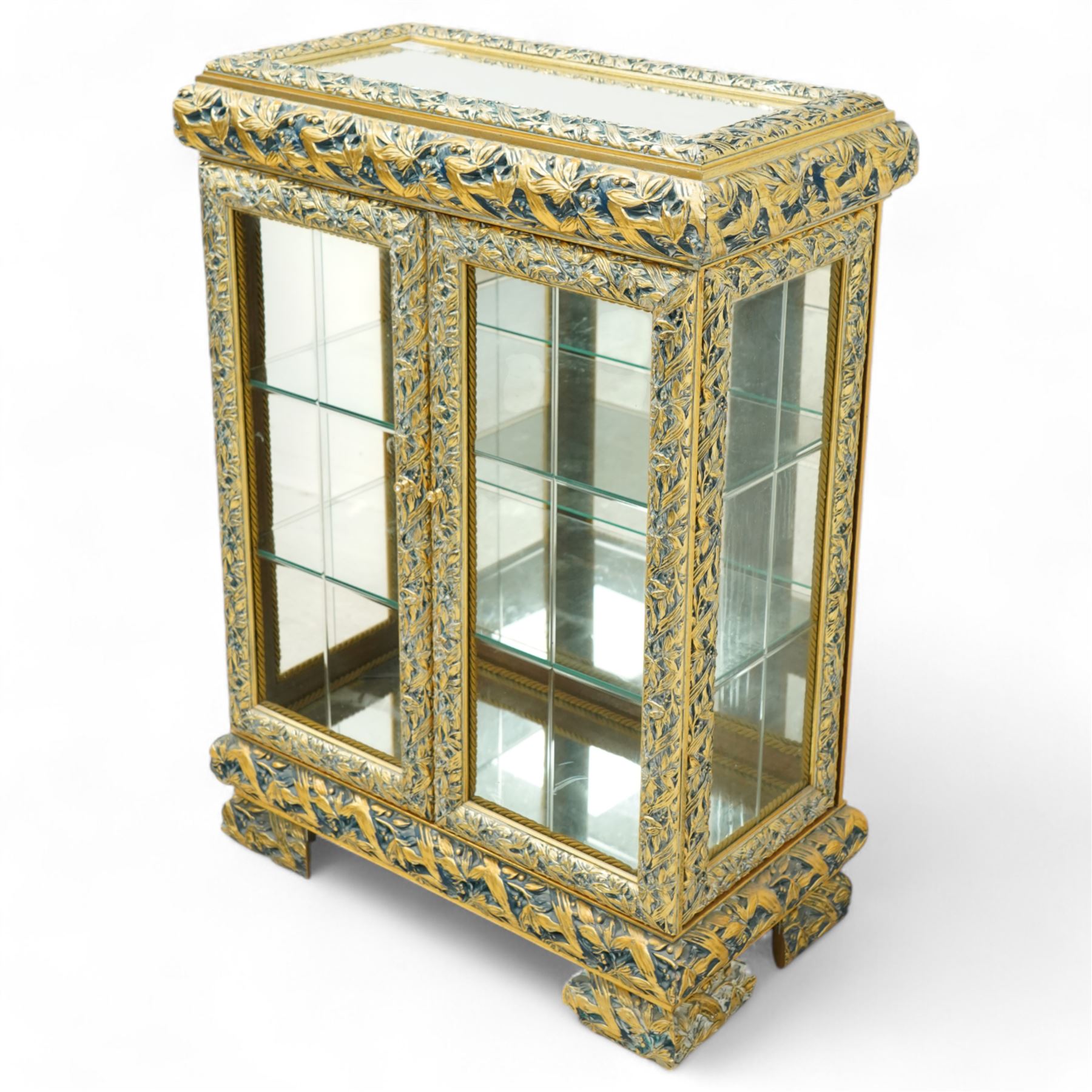 Astoria Grand, Constance dining cabinet, mirrored top, carved wood and gold painted, two glass panelled doors with glass shelves on bracket-type feet
