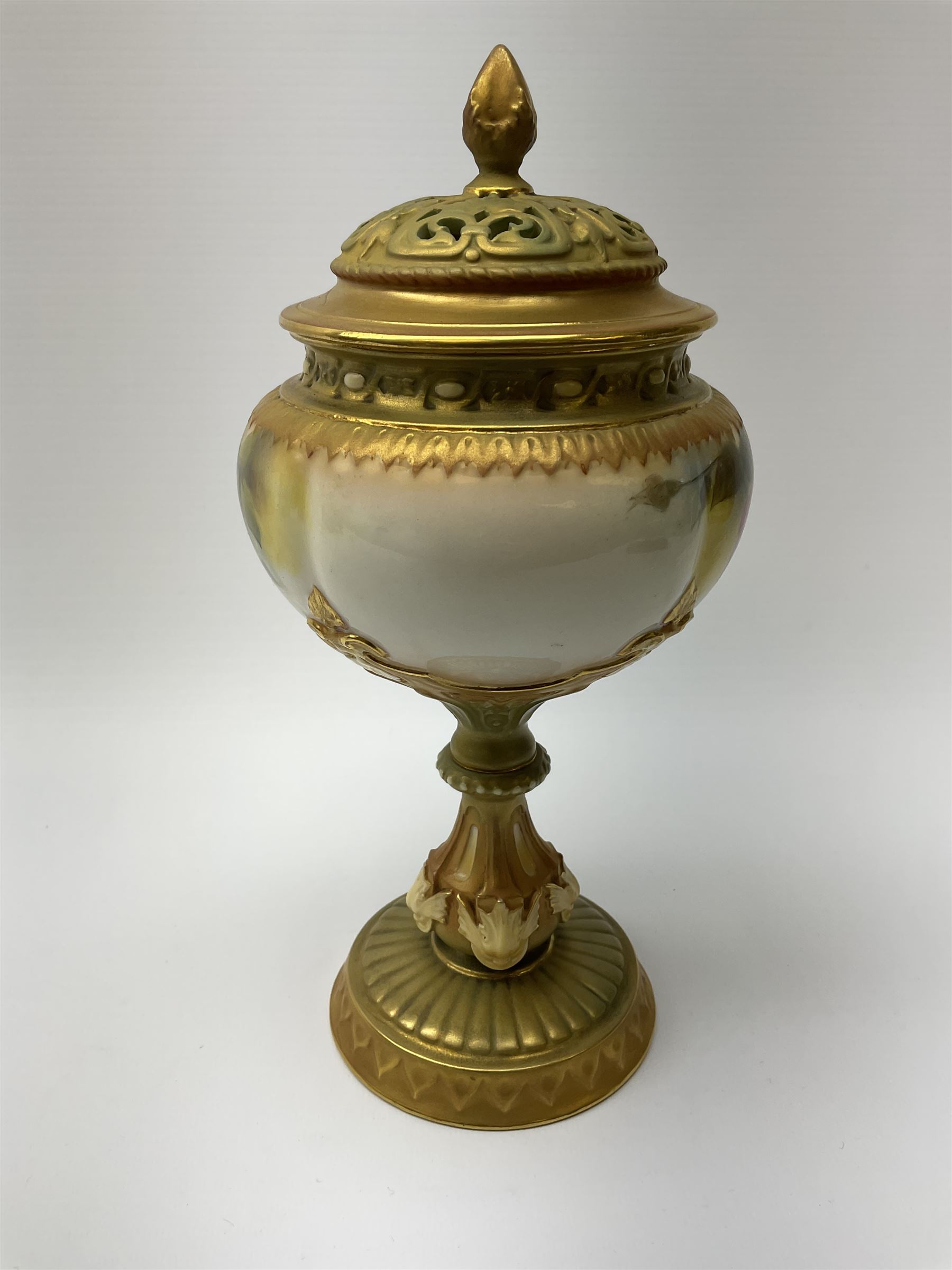 A Royal Worcester potpourri vase and cover, shape 1813, the bulbous body hand painted with pink roses and signed A Watkins, supporting a gilded and burnished pierced cover, upon a moulded stem with zoomorphic mask detail and circular foot, with puce printed mark beneath, H24cm