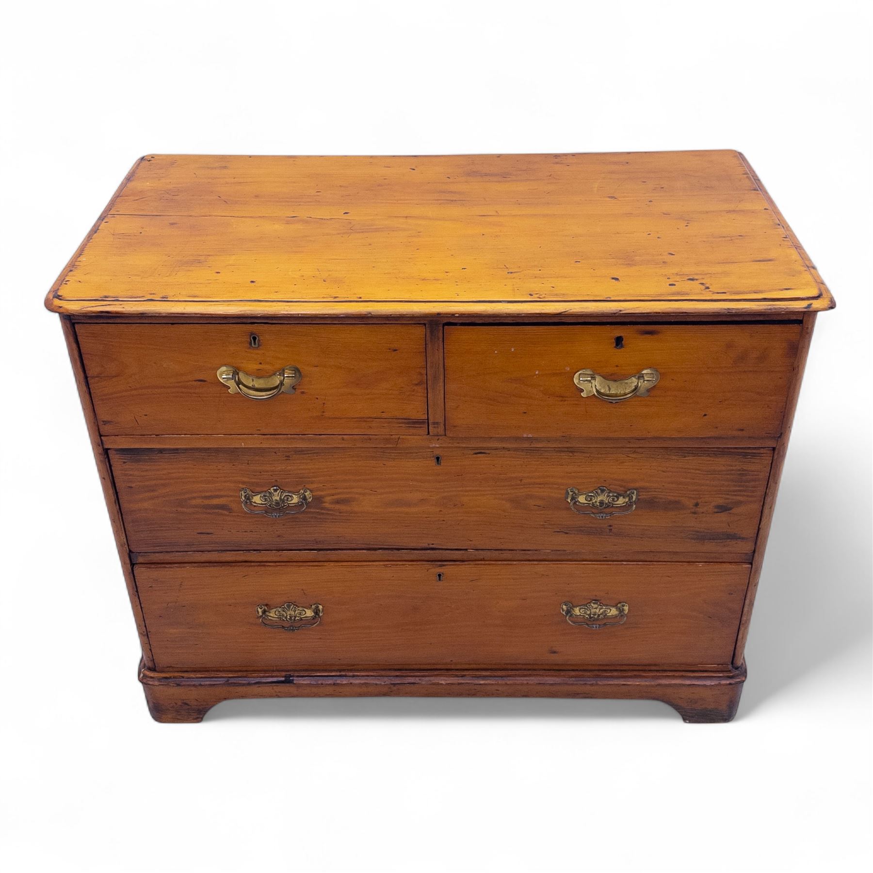 19th century pine chest of drawers, rectangular moulded top over two short and two long drawers fitted with brass handles, raised on bracket feet