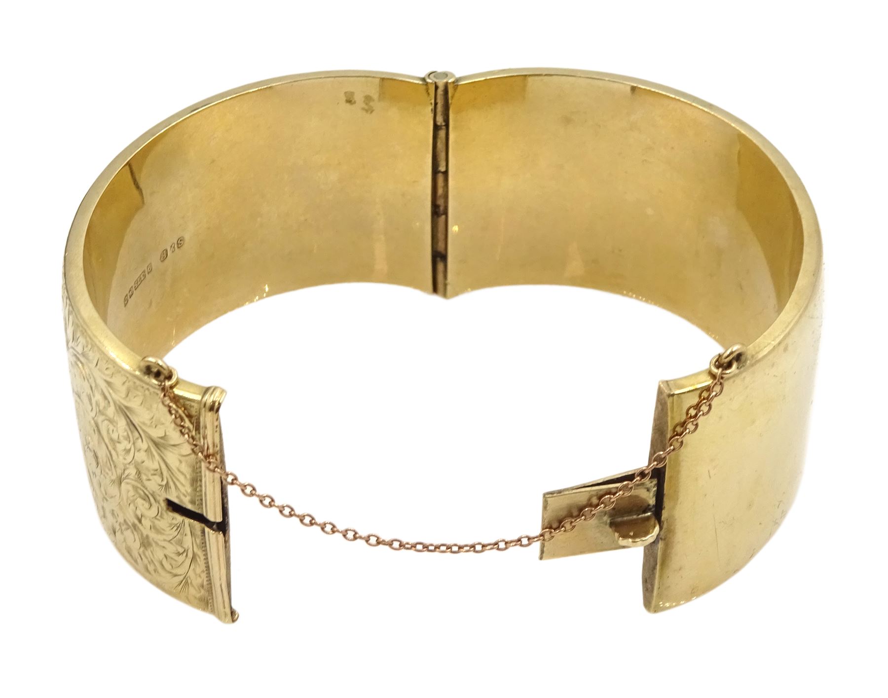 9ct gold wide hinged bangle, with bright cut foliate decoration, by Smith & Pepper Ltd, Birmingham 1963, boxed