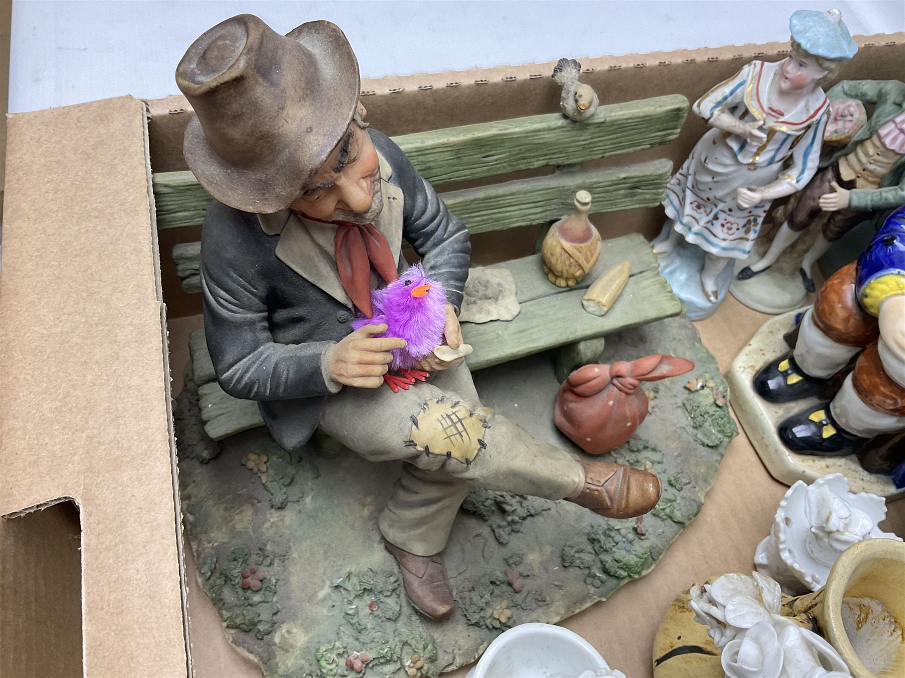 Collection of ceramics to include Royal Doulton Winston Churchill toby jug, Capodimonte style figures, novelty brandy decanter etc, in two boxes