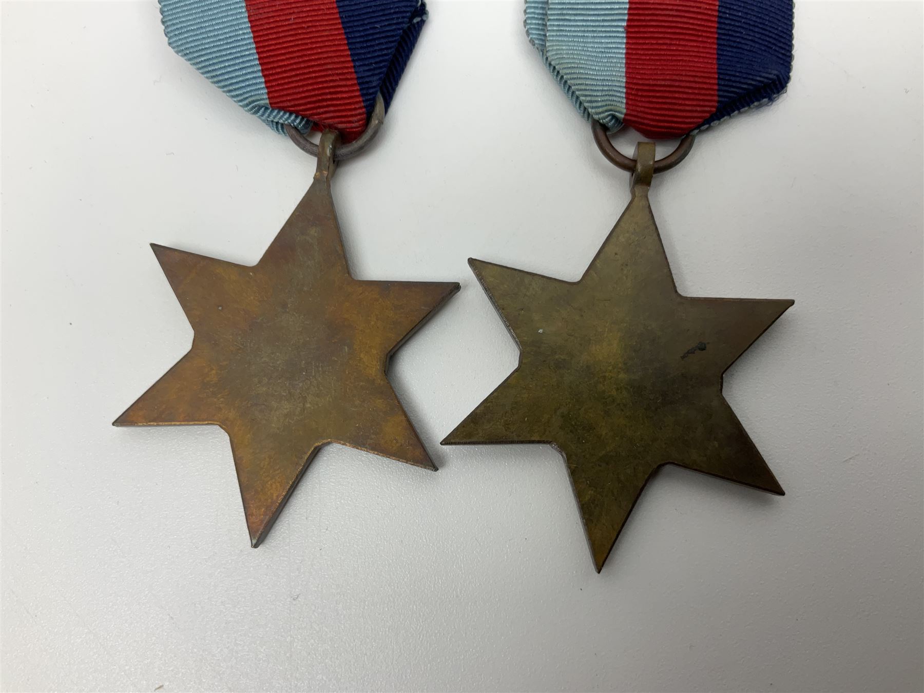 Eleven WW2 medals comprising three 1939-1945 war medals, two Defence medals, three 1939-1945 Stars, Atlantic Star, Africa Star and Italy Star; miniature QEII Naval LS & GC medal; all with ribbons; and WW2 postumous medal slip to Flight Sergeant L.N. Clark