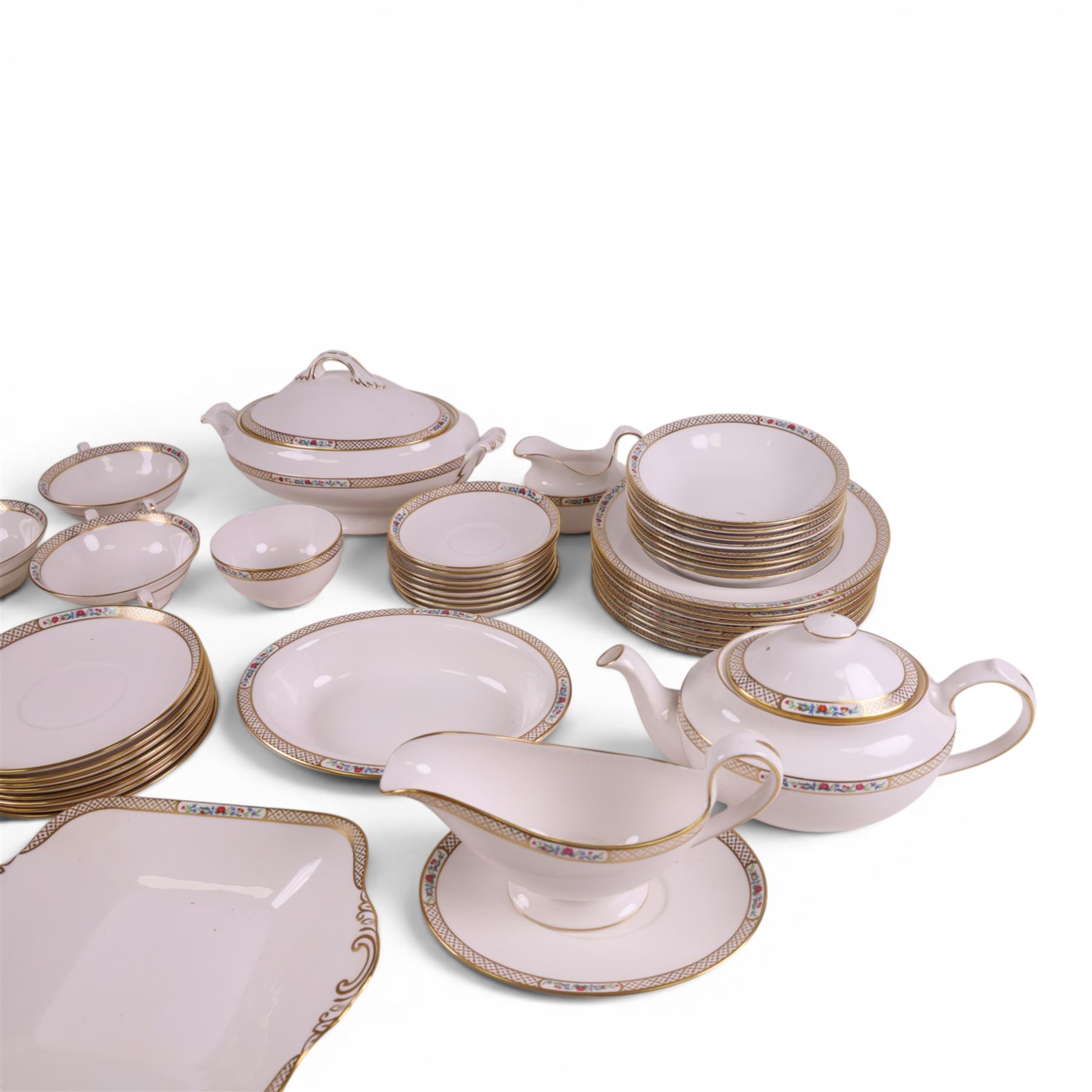 Spode Golden Trellis tea and dinner service for eight, including teapot, milk jug, open sucrier, teacups and saucers, dinner plates, soup bowls, side plates etc 