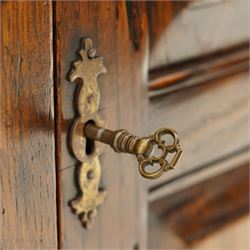 18th century style oak dresser base, rectangular moulded top over two frieze drawers with brass handles, twin panelled cupboard doors below with pierced brass escutcheons, on stile feet