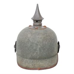 WWI Prussian 22nd regiment Ersatz Felt Pickelhaube, the grey felt skull with steel spike finial, 22 helmet plate and leather chin strap, one side with a black cockade, the other black and red,  the inner back brim stencilled BA 1X Wm Kleddinghaus & C, Elberfeld, 1916, H24cm