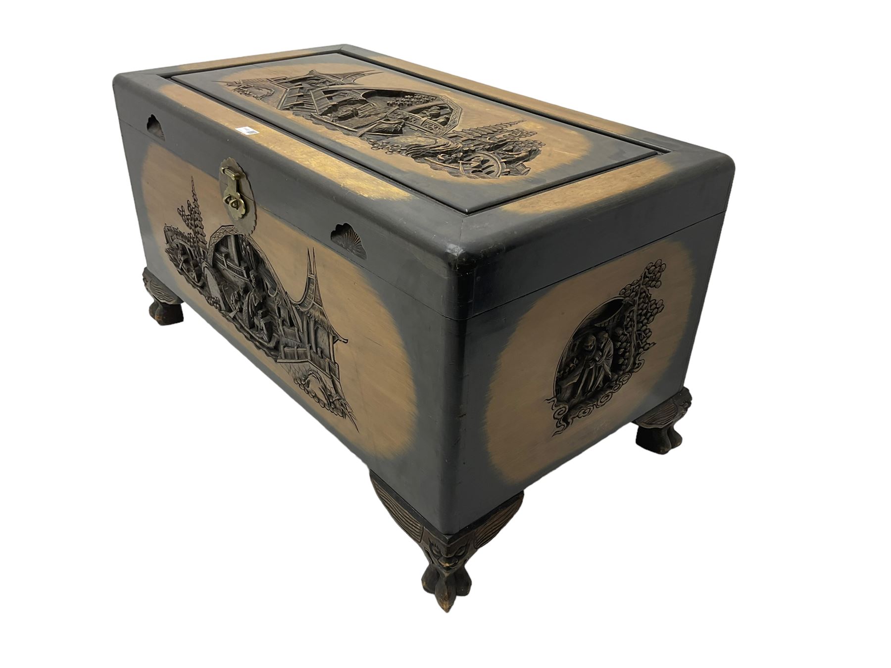 Singapore camphor wood blanket chest, rectangular hinged top with carved panel depicting traditional pagoda and river scenes