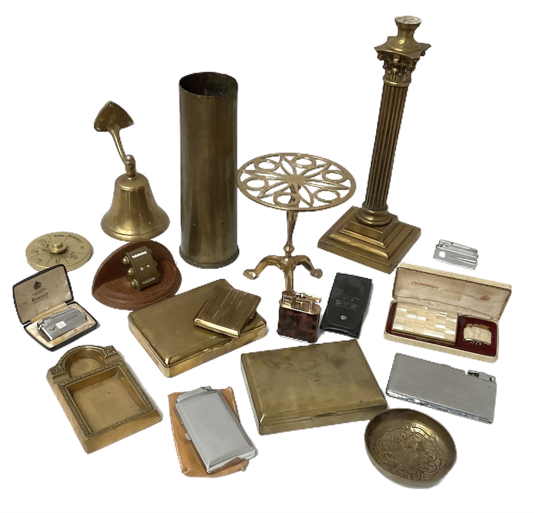 Quantity of brass to include Canadian 18 Pr. Mark II brass shell case,  Corinthian column candlestick with weighted base, perpetual desk calendar on wood base, engine turned cigarette cases and a quantity of metal table lighters etc