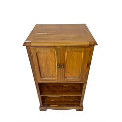 Unicornman - yew wood cabinet, moulded hinged lid over two panelled doors and shelves (W56cm, H99cm, D45cm); and four Unicorn man CD racks two in yew wood and two in oak (W20cm, H36cm, D20cm); all carved with unicorn signature and by Geoff Gell, Coxwold
