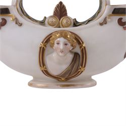 Royal Worcester double-ended vase, modelled in relief with mask panels in the classical dress the central handle with foliate and scroll work, H16cm 
