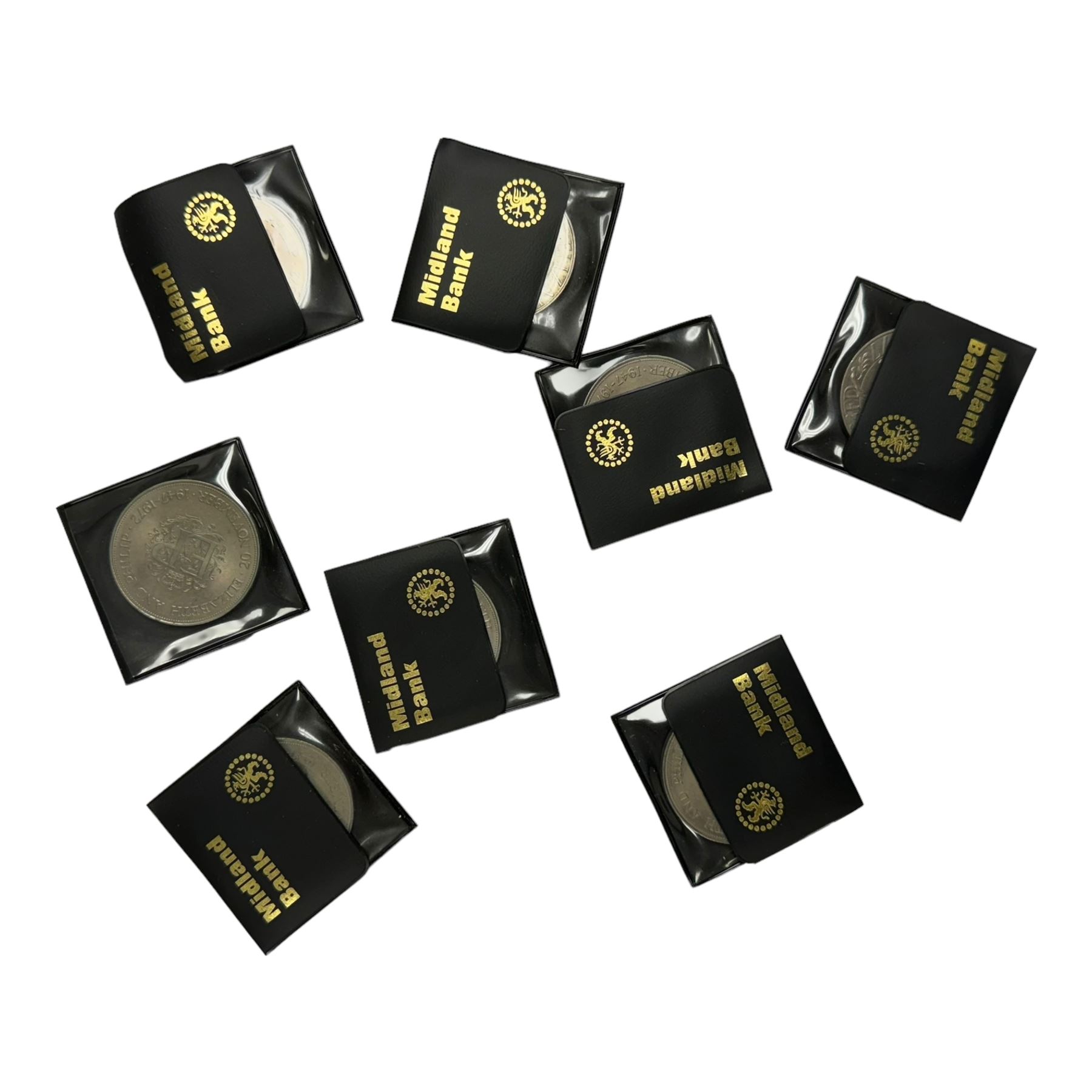 Mostly commemorative coins, medallions and fantasy coinage, including various 'Sainsbury's Makers of the Millennium' medal collection folders containing various medallions, The Toer Mint commemorative four medallion set in fitted case, Queen Elizabeth II 1982 silver proof piedfort twenty pence coin cased with certificate, various part filled The London Mint office folders etc