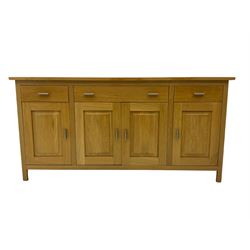 G-Plan - light oak sideboard, fitted with three drawers and four panelled cupboards