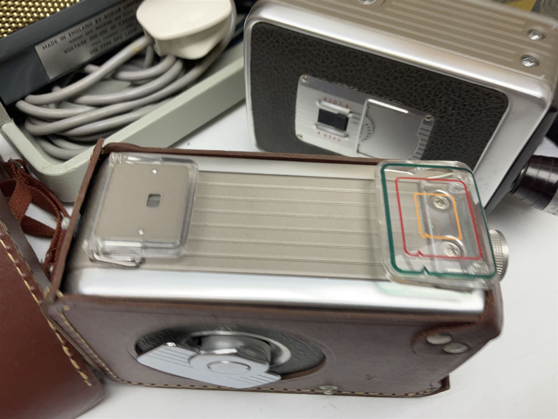 Bolex Paillard P3 Zoom Reflex camera body, serial no 38090, with 'B te S.G.D.G Som Berthiot Pan-Cinor 1:1.9 f=8a 40' lens, serial no. 40251438 in case, Kodak Brownie movie camera, Kodak model 2 Brownie movie camera and a Kodak 8 Movie Projector A-15G and other camera equipment 