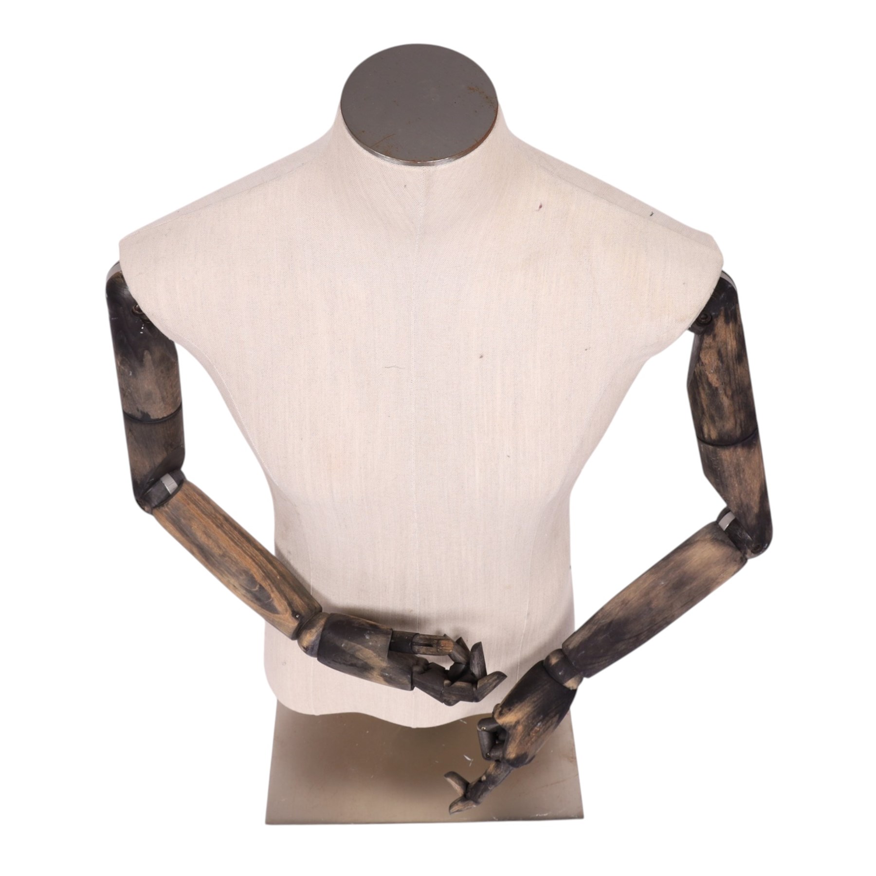 Male mannequin torso with fabric body and poseable wooden arms, on a square metal base